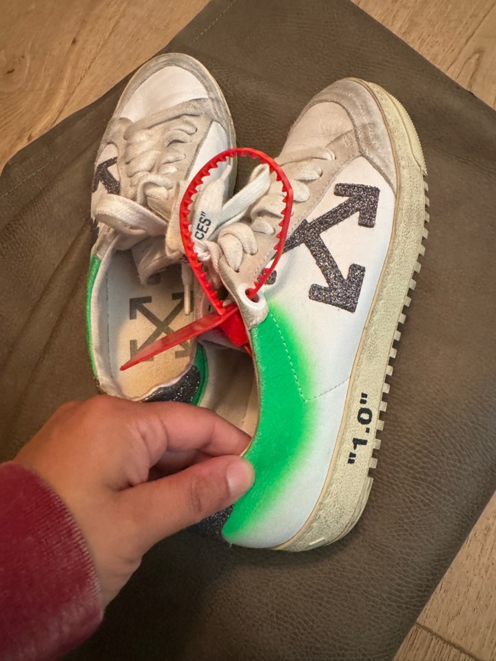 Off-White Sneakers with Green Spray and Black Arrow